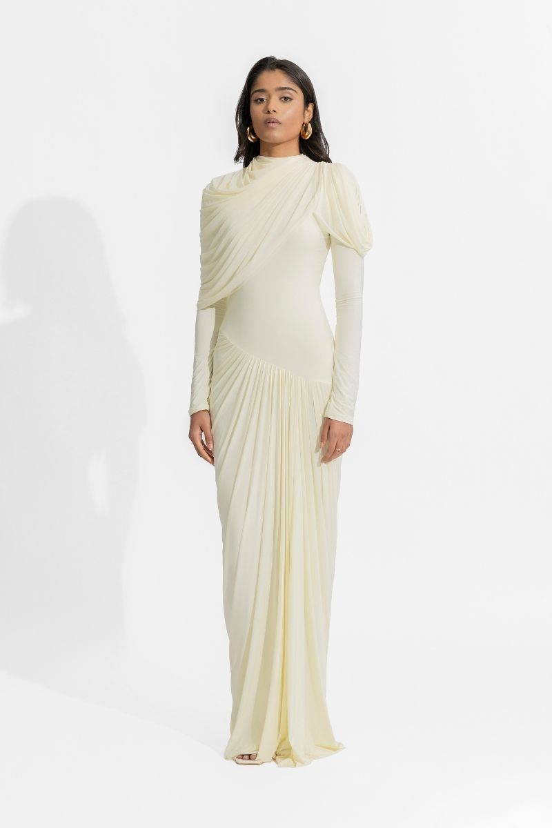 Deme By Gabriella Paulina off-white gown with elegant flowing fabric and delicate detailing, perfect for formal occasions.