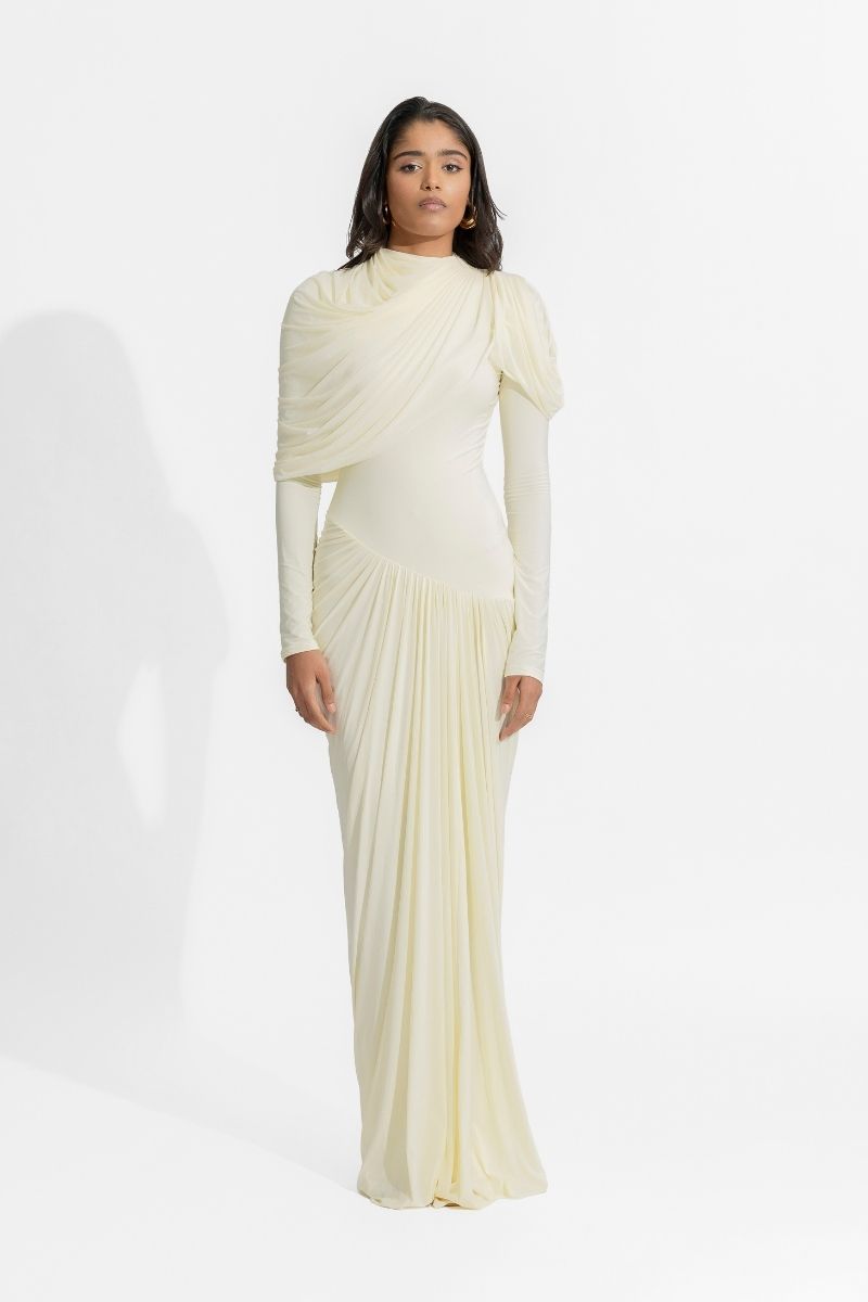 Elegant off-white Deme By Gabriella Paulina gown with flowing fabric and intricate design, perfect for formal occasions.