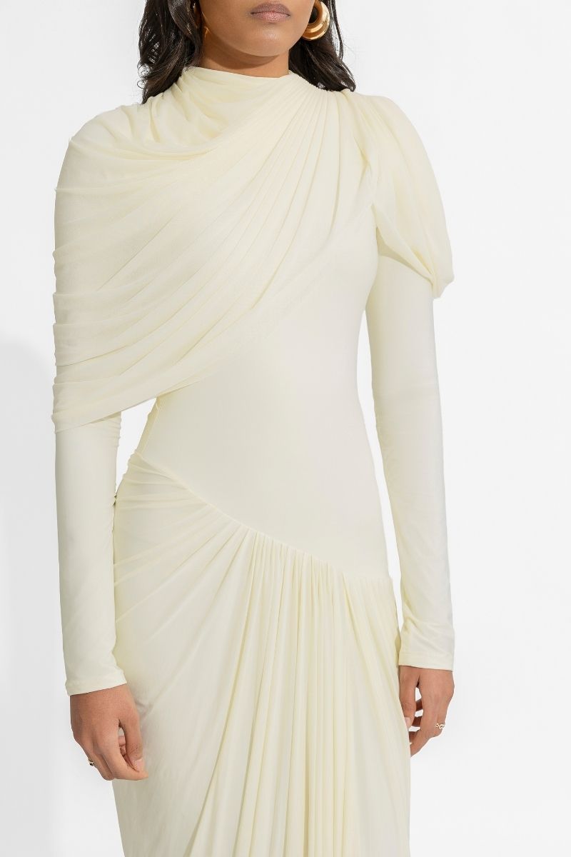 Deme By Gabriella Paulina Off White gown with elegant flowing fabric and intricate detailing, perfect for formal occasions.