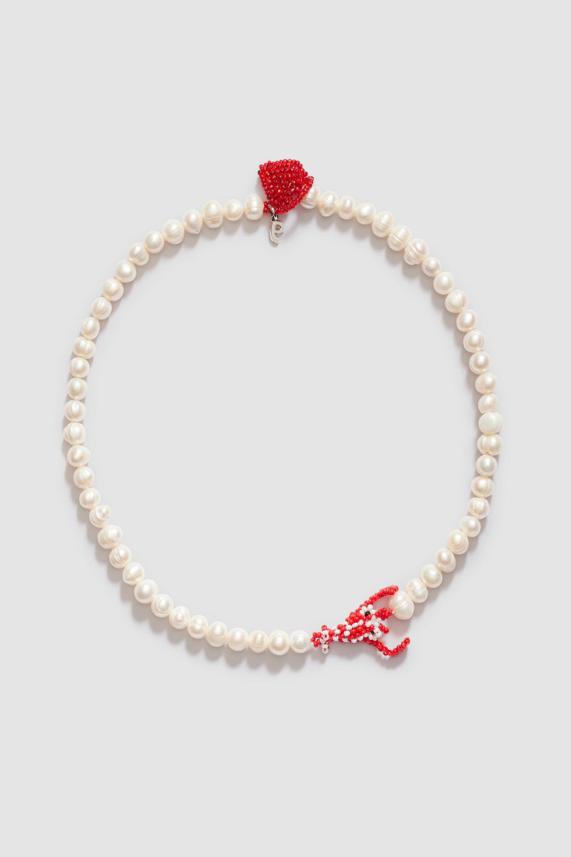 Pura Utz Pearl Lobster Love Necklace featuring a pearl and lobster charm on a delicate chain.
