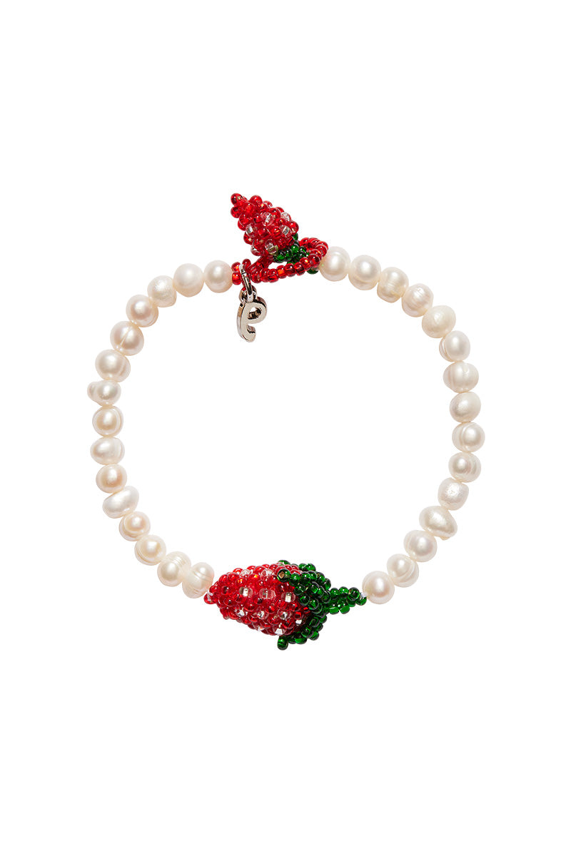 Pearl strawberry bracelet by Pura Utz featuring white pearls and strawberry-shaped charm, stylish and feminine jewelry accessory.