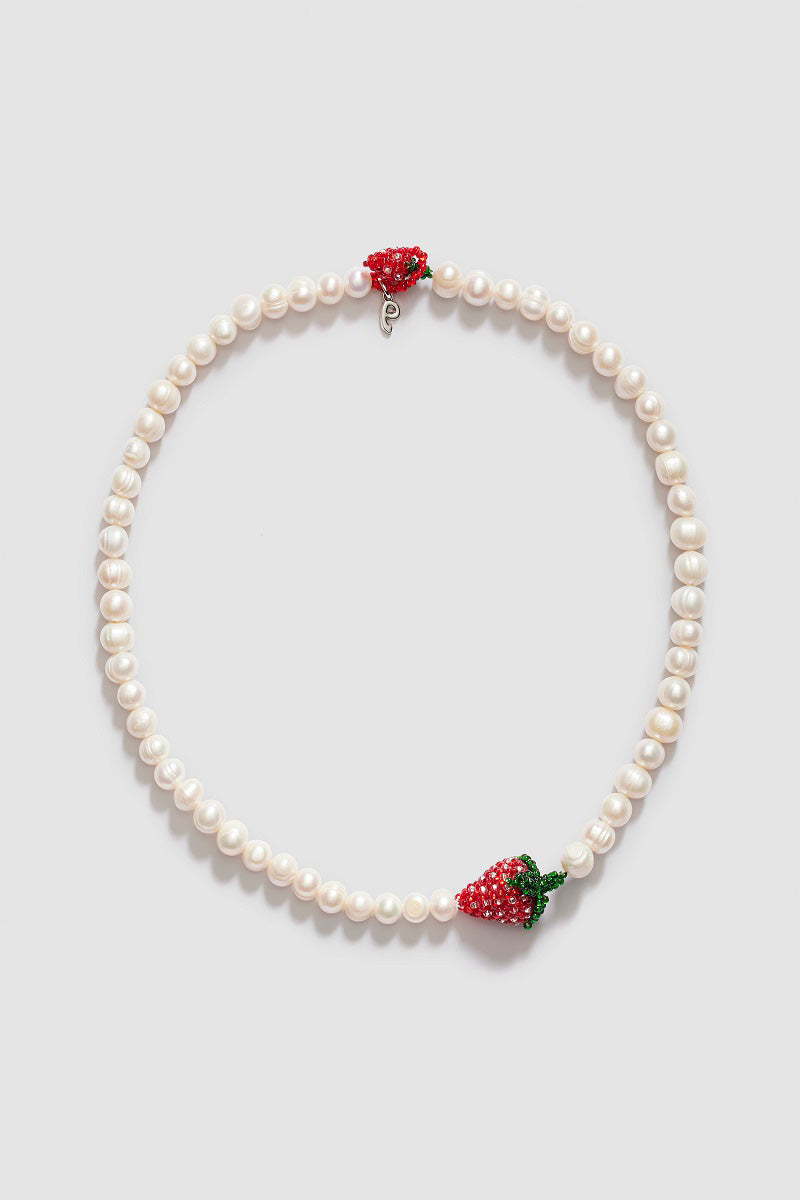 Pura Utz Pearl Strawberry Necklace featuring a delicate pearl and strawberry-shaped pendant on a fine chain.