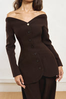 Close-up of YASSMIN SALEH Peekaboo Brown Blazer showing tailored lapels and textured fabric detail.