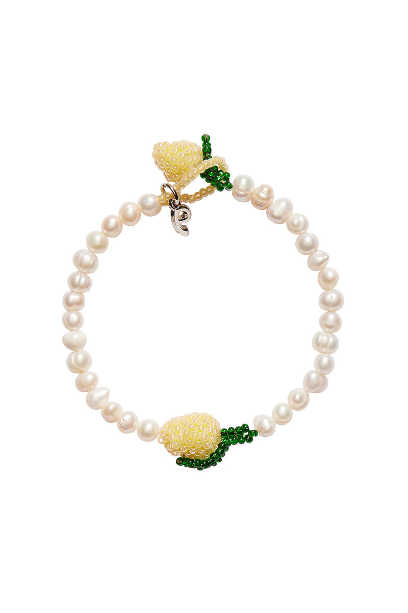 Pura Utz Pearl Lemon bracelet featuring white pearls and yellow lemon charms, stylish jewelry accessory for women.