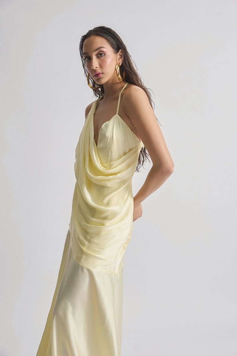 Deme By Gabriella CULT MIA X DEME maxi dress in flowing fabric with floral pattern, sleeveless design, and elegant length.