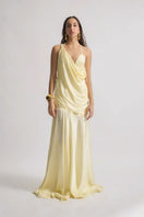 Deme by Gabriella CULT MIA X DEME maxi dress in flowing fabric with floral pattern, sleeveless design, and V-neck style.