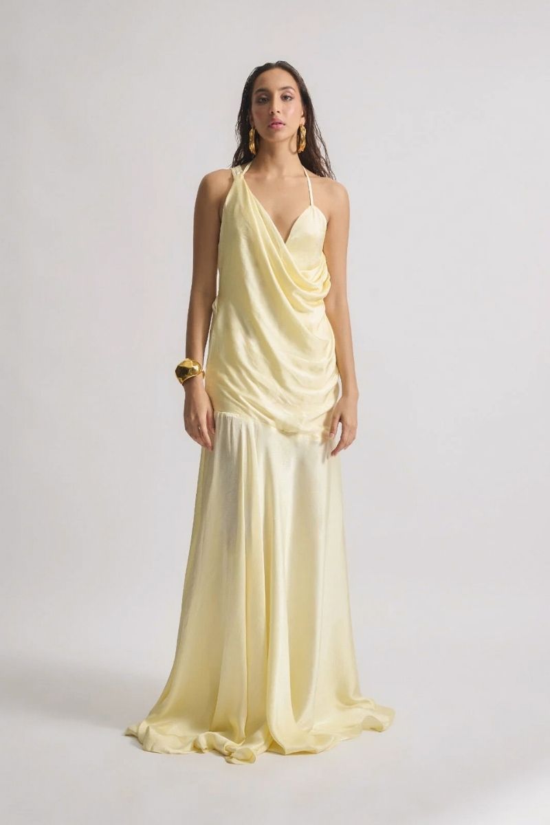 Deme by Gabriella CULT MIA X DEME maxi dress in flowing fabric with floral pattern, sleeveless design, and V-neck style.