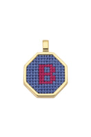 Blue personalised letter pendant necklace by Maria Frering featuring a custom engraved initial on a delicate chain.