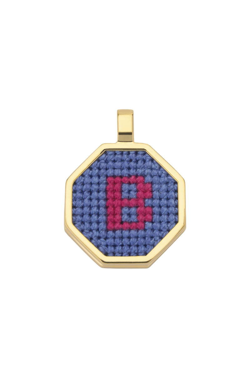 Blue personalised letter pendant necklace by Maria Frering featuring a custom engraved initial on a delicate chain.