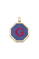 Blue personalized letter pendant necklace by Maria Frering, featuring a custom engraved initial on a delicate chain.