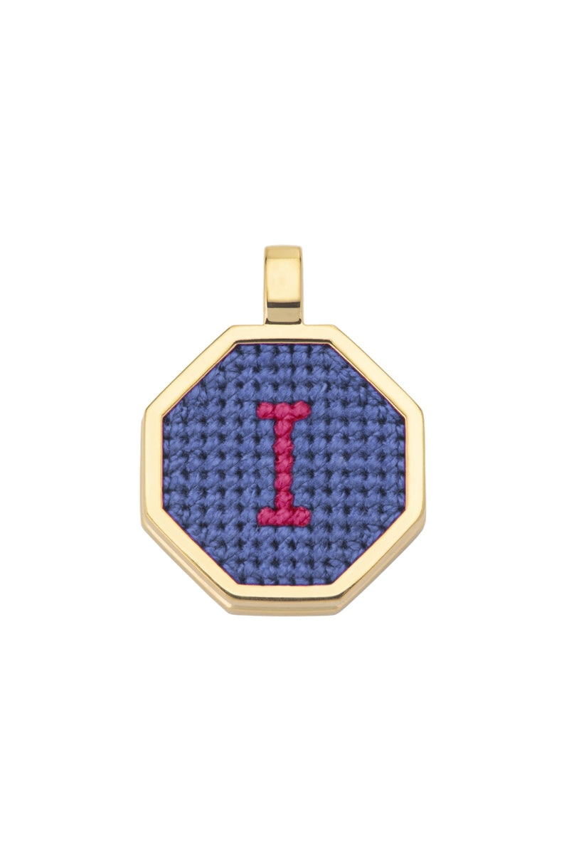Blue personalized letter pendant necklace by Maria Frering featuring a custom engraved initial on a delicate chain.