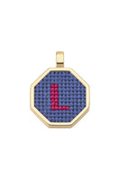 Blue personalized letter pendant necklace by Maria Frering, featuring a custom initial charm on a delicate chain.