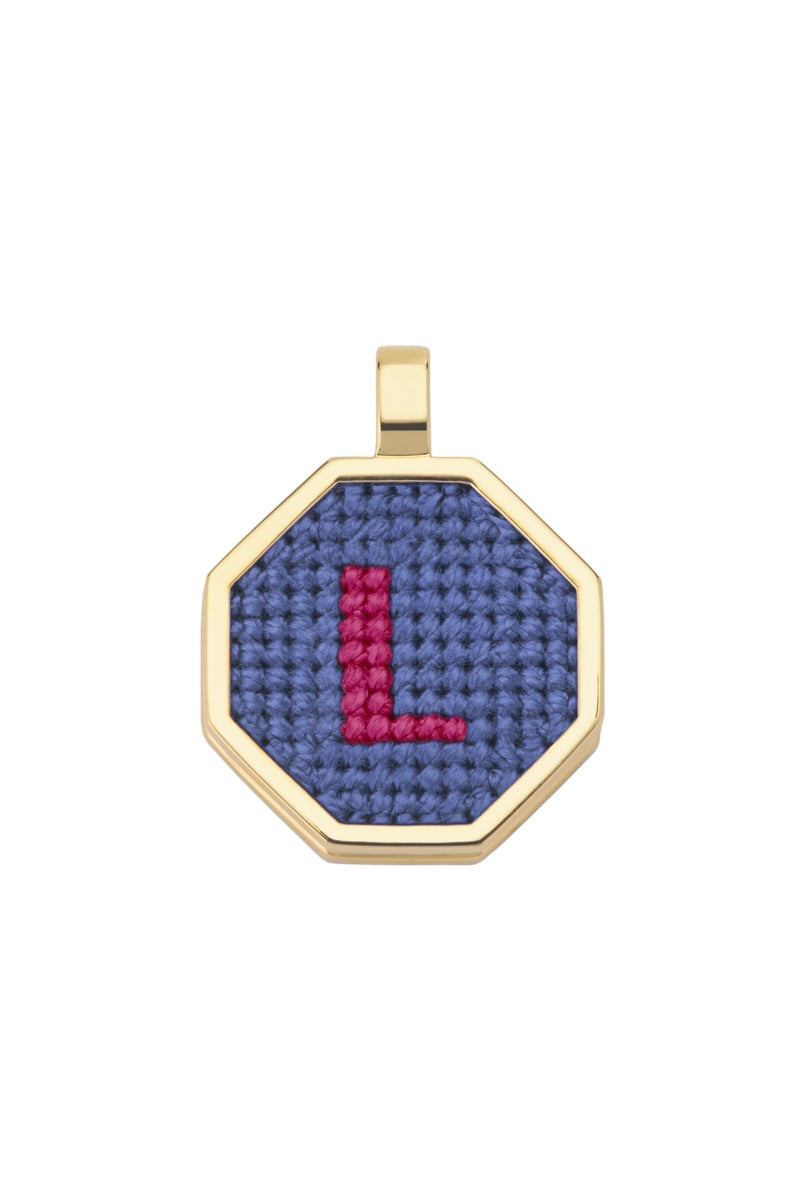 Blue personalized letter pendant necklace by Maria Frering, featuring a custom initial charm on a delicate chain.