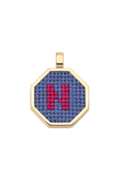 Personalised letter pendant necklace by Maria Frering with a blue charm, featuring a custom initial on a delicate chain.
