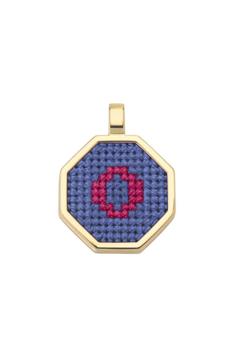 Blue personalized letter pendant necklace by Maria Frering featuring custom engraved initial on a delicate chain.
