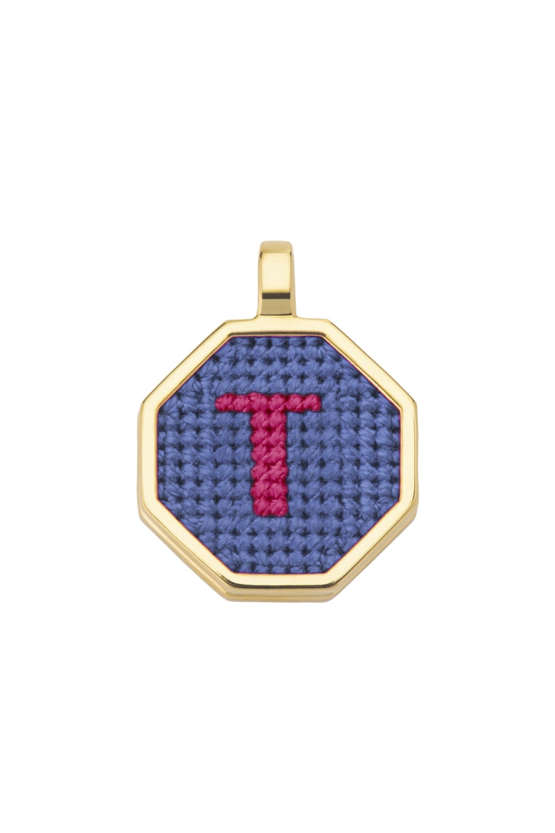 Personalized blue letter pendant necklace by Maria Frering featuring custom letter charm on silver chain.