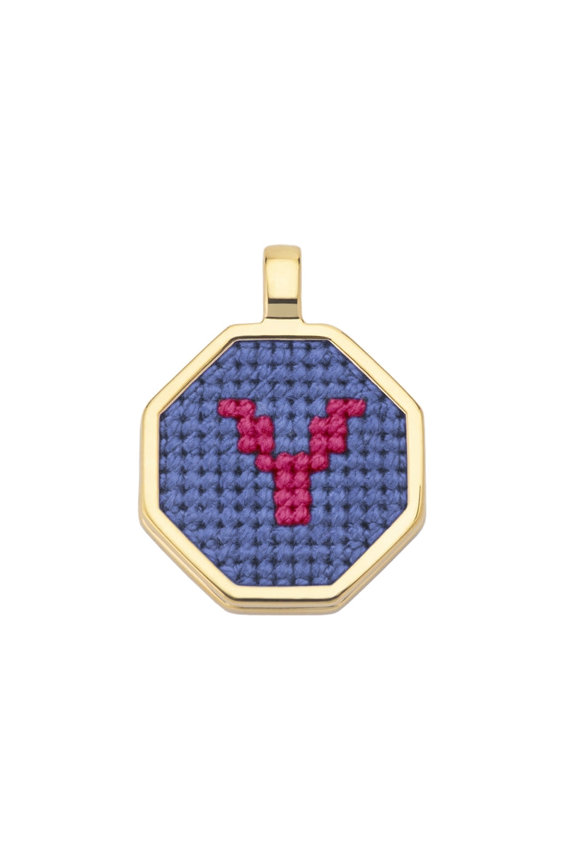 Blue personalized letter pendant necklace by Maria Frering, featuring a custom engraved initial on a delicate chain.