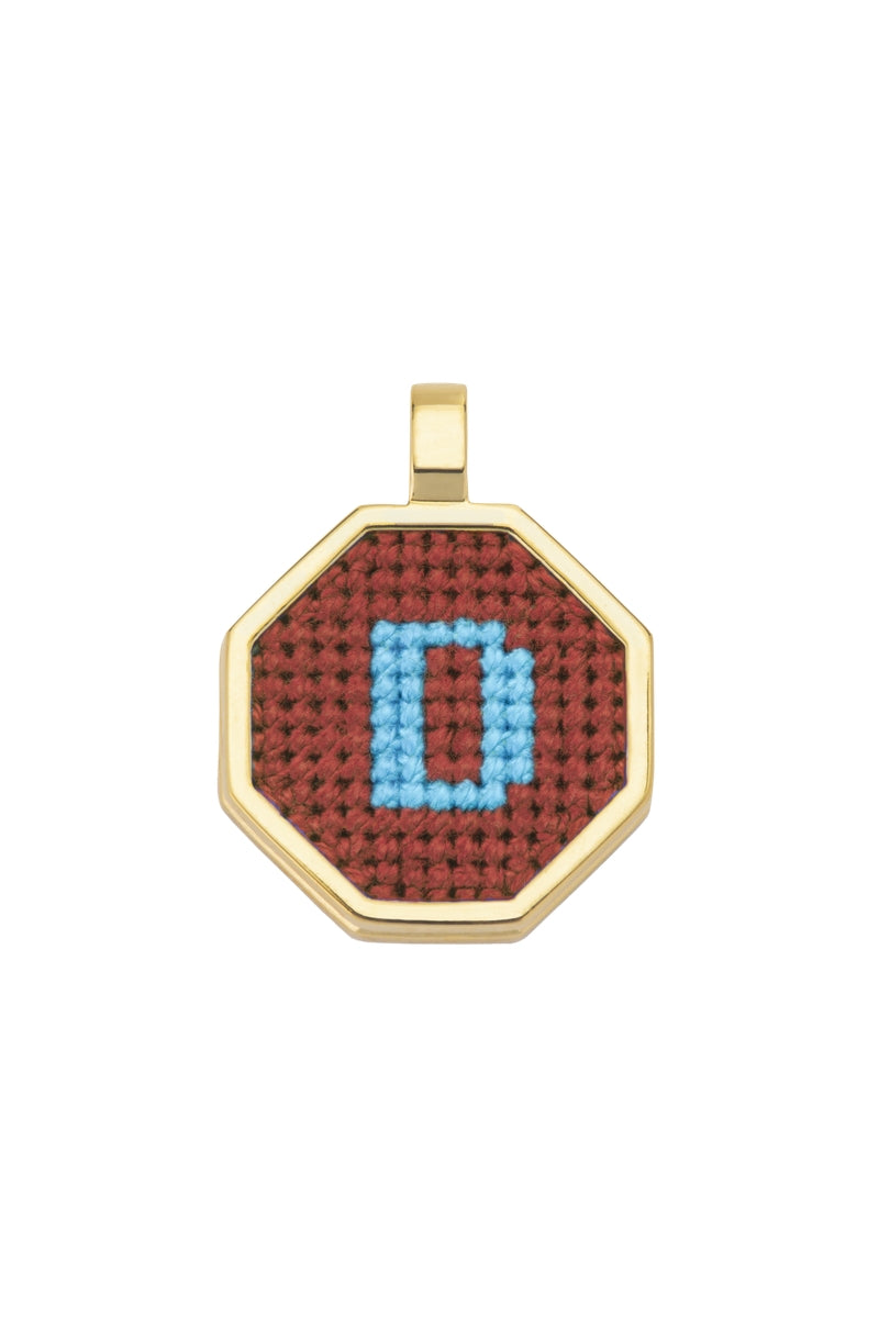 Personalised letter pendant necklace by Maria Frering in brown with custom initial charm on a delicate chain.