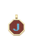 Personalised letter pendant necklace by Maria Frering with a brown leather cord and custom initial charm.