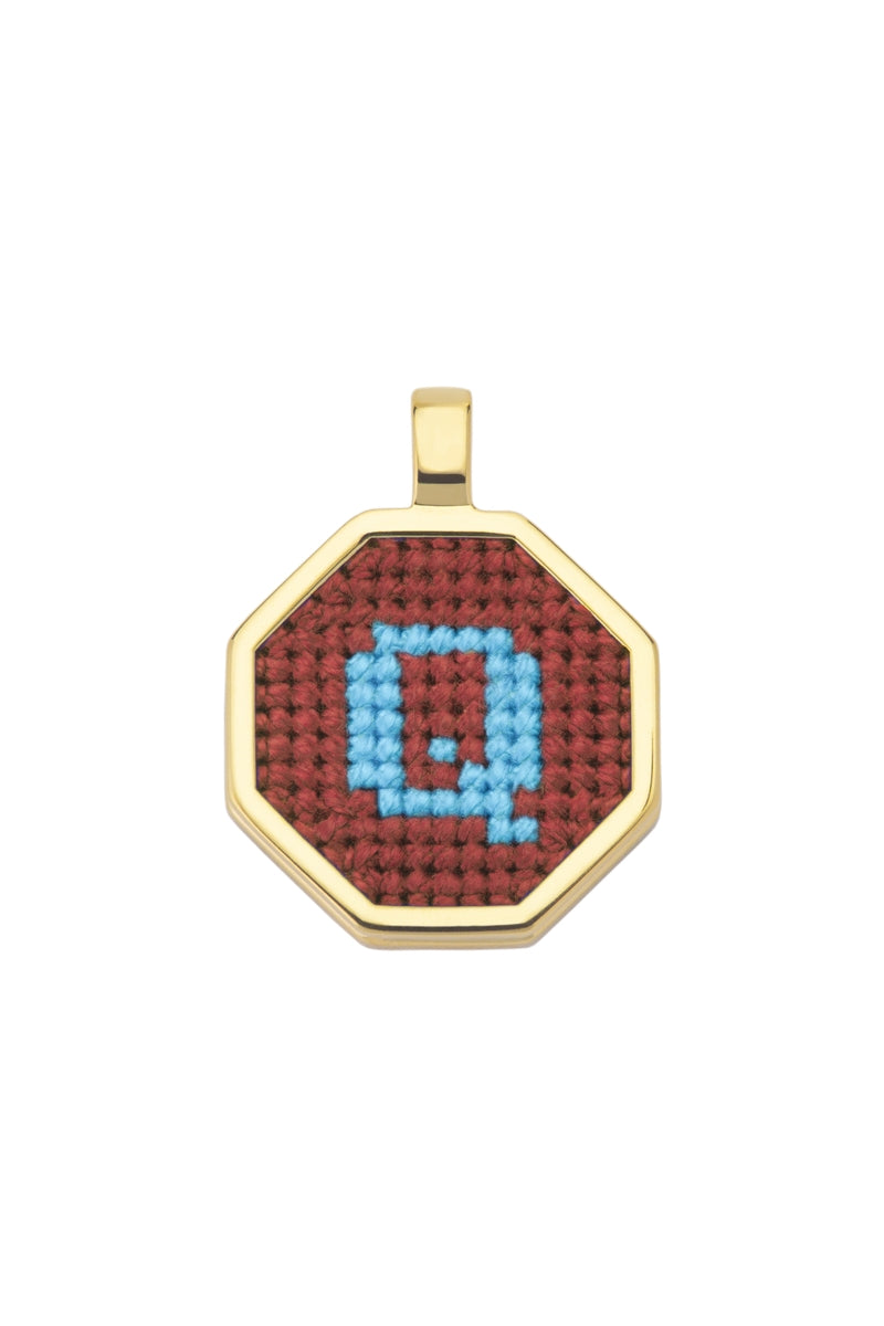 Personalised letter pendant necklace by Maria Frering featuring a brown pendant with engraved initial.