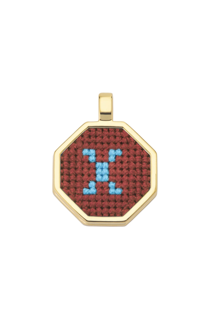 Personalised letter pendant necklace by Maria Frering featuring a brown pendant with custom initial on a delicate chain.