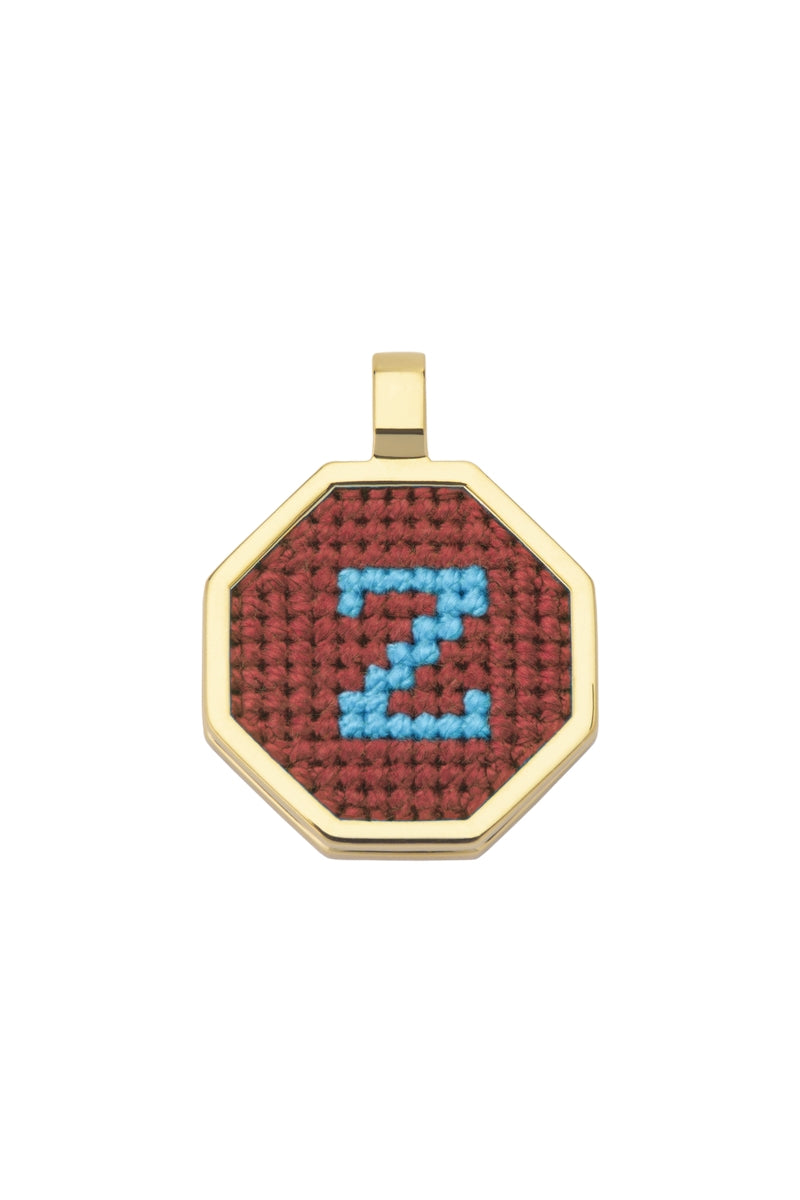 Personalised letter pendant necklace from Maria Frering with a brown finish, featuring a custom engraved letter on a delicate chain.