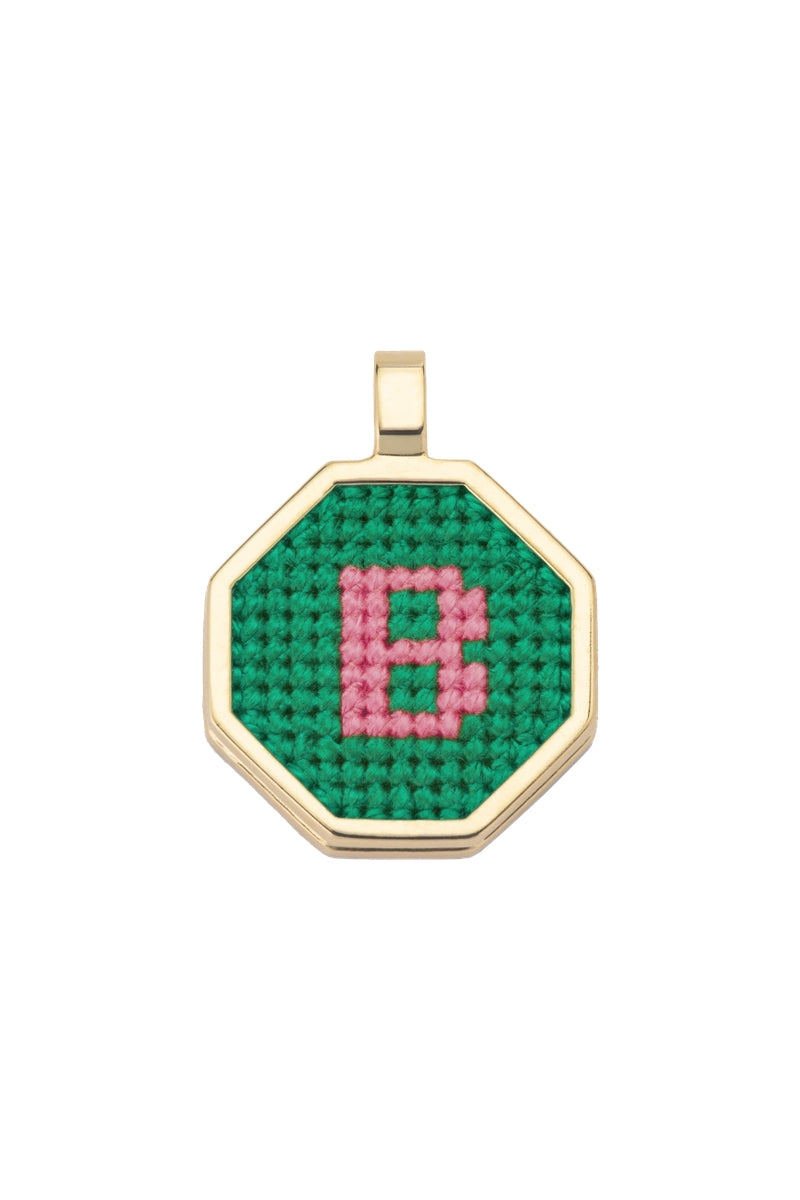 Personalised letter pendant necklace by Maria Frering featuring a green pendant with custom letter design.