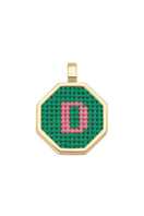 Personalised letter pendant necklace by Maria Frering with a green gemstone accent on a silver chain.