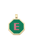 Personalised letter pendant necklace by Maria Frering with a green pendant, featuring custom initials on a delicate chain.