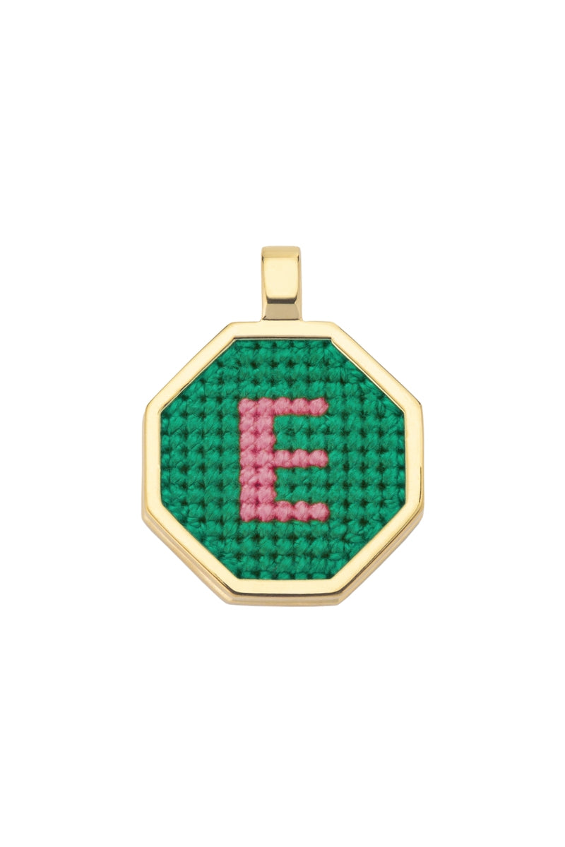 Personalised letter pendant necklace by Maria Frering with a green pendant, featuring custom initials on a delicate chain.