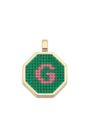 Green personalized letter pendant necklace by Maria Frering, featuring a custom engraved initial on a delicate chain.