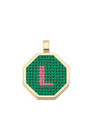 Personalised letter pendant necklace by Maria Frering featuring a green charm on a delicate chain.