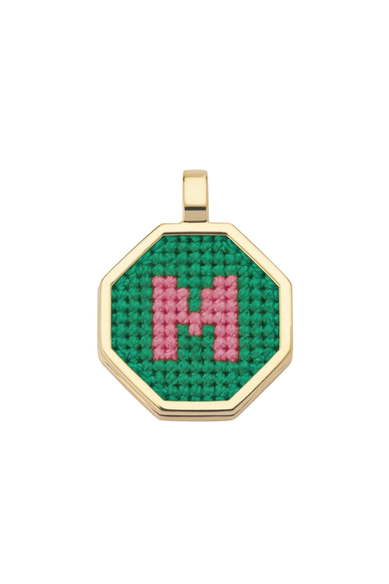Personalised letter pendant necklace by Maria Frering featuring a green pendant with custom initial design.