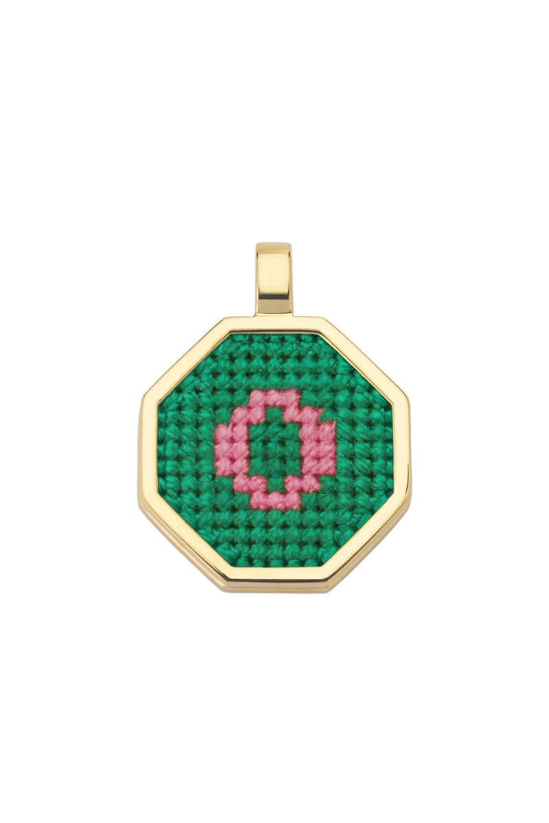 Personalised letter pendant necklace by Maria Frering featuring a green gemstone accent, elegant and customizable jewelry piece.