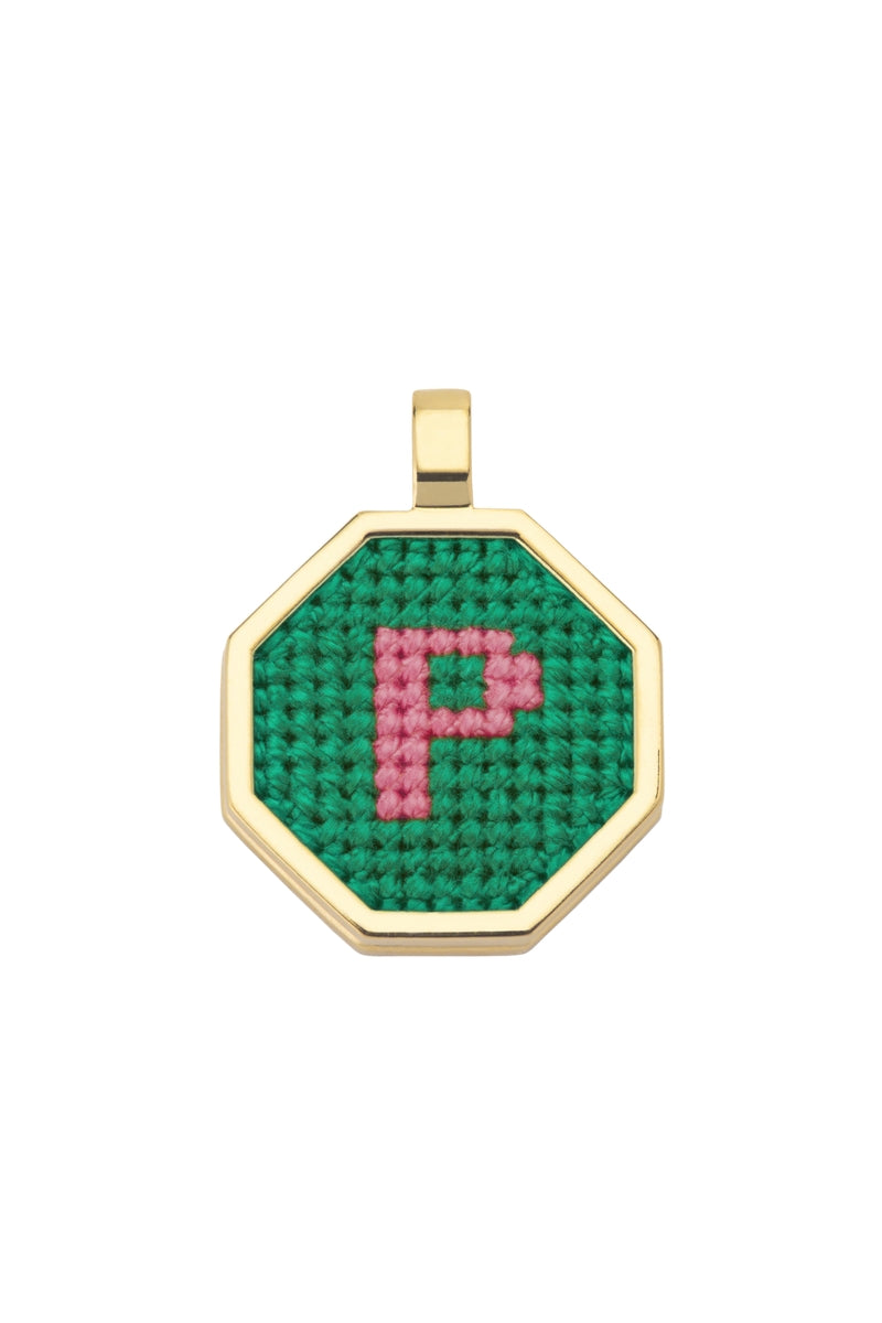 Personalised letter pendant necklace by Maria Frering featuring a green pendant with custom letter engraving.