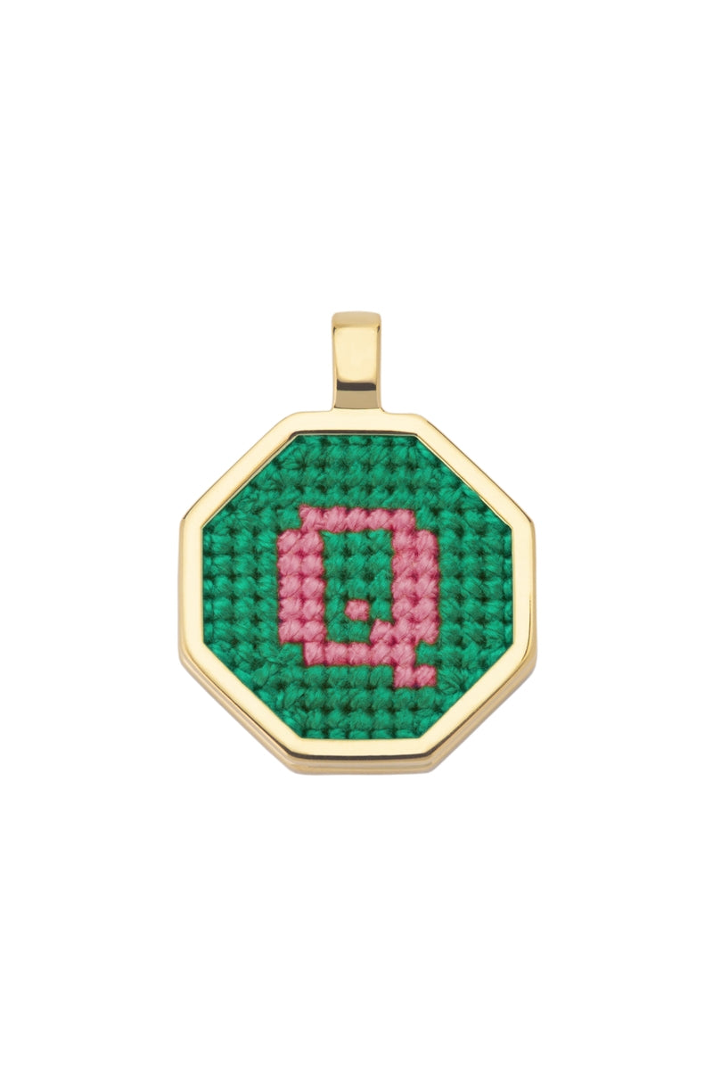 Personalised letter pendant necklace by Maria Frering featuring a green pendant with custom initial design.