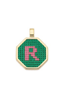 Personalised letter pendant necklace by Maria Frering featuring a green letter charm on a delicate chain.