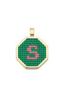 Personalised letter pendant necklace by Maria Frering with a green charm and delicate chain.