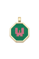 Personalised letter pendant necklace by Maria Frering with a green charm, featuring a custom letter design.