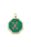 Personalised letter pendant necklace by Maria Frering featuring a green charm with engraved letter.