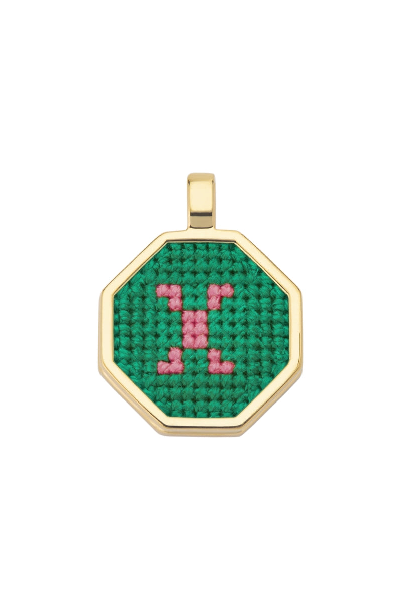 Personalised letter pendant necklace by Maria Frering featuring a green charm with engraved letter.