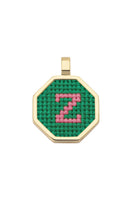 Personalised letter pendant necklace by Maria Frering with green gemstone detail, featuring a custom initial charm.