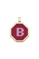 Personalised letter pendant necklace by Maria Frering featuring a red pendant with custom initial.