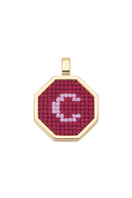 Red personalized letter pendant necklace by Maria Frering featuring a custom letter charm on a delicate chain.