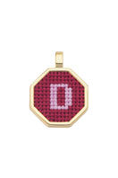 Personalised letter pendant necklace by Maria Frering featuring a red pendant with custom initial design.