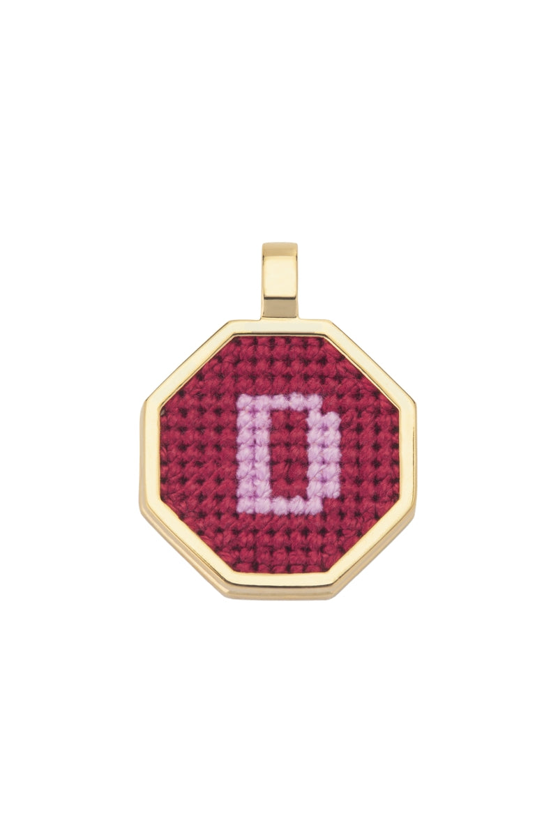 Personalised letter pendant necklace by Maria Frering featuring a red pendant with custom initial design.