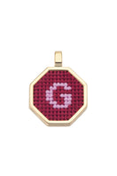 Red personalized letter pendant necklace by Maria Frering featuring a custom initial charm.