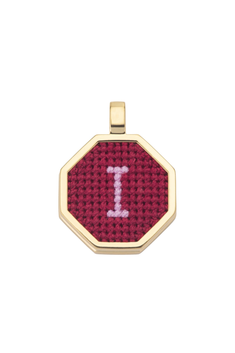 Personalised letter pendant necklace by Maria Frering featuring a red letter charm on a delicate chain.