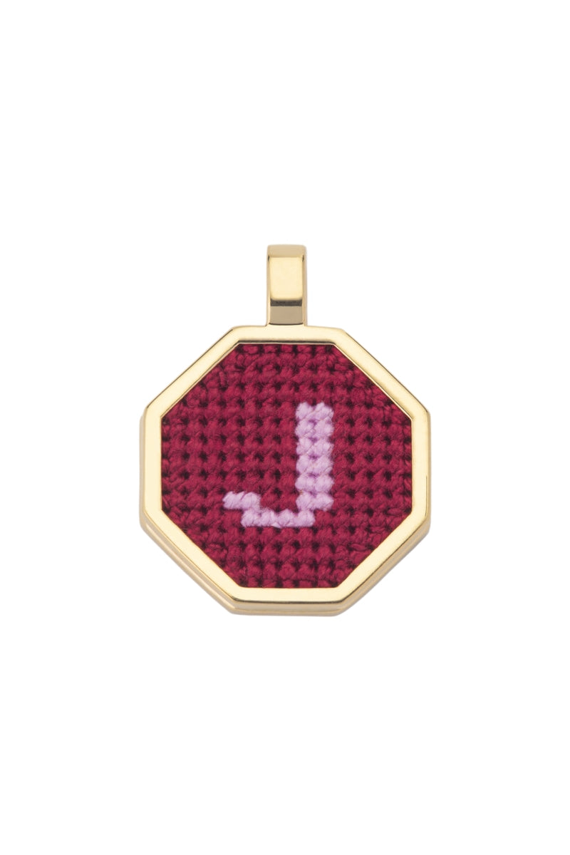 Personalised letter pendant necklace by Maria Frering with a red pendant, featuring a custom initial design.