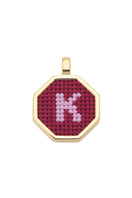 Personalised letter pendant necklace by Maria Frering featuring a red letter charm on a delicate chain.